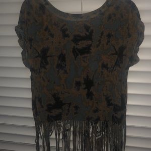 A tie-dye shirt with cuts at the bottom